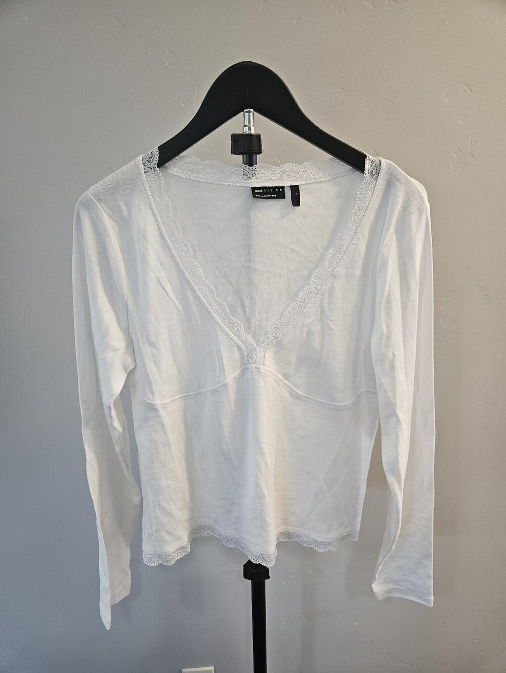 ASOS DESIGN long-sleeve white top with a v-neck and delicate lace detailing